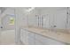 Bright bathroom with double sinks, modern fixtures, and sleek countertops at 7813 Ailesbury Rd, Wake Forest, NC 27587