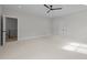 Large bedroom with neutral carpet and view of the staircase landing at 7813 Ailesbury Rd, Wake Forest, NC 27587