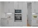 Close up of a modern kitchen with stainless steel appliances, custom cabinets, and elegant countertops at 7813 Ailesbury Rd, Wake Forest, NC 27587
