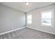 Comfortable bedroom with carpeting, natural lighting, and neutral paint at 85 Windchime Ct, Fuquay Varina, NC 27526