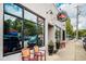 A view of Vicious Fishes Brewery with a logo above the doors and plants on the patio at 85 Windchime Ct, Fuquay Varina, NC 27526
