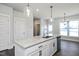 Modern kitchen with granite countertops and stainless steel appliances at 85 Windchime Ct, Fuquay Varina, NC 27526