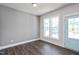 Bright room with hardwood floors and ample sunlight from two windows at 85 Windchime Ct, Fuquay Varina, NC 27526