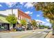 Street view of building facades with retail shops, restaurants and vehicles parked along the street at 85 Windchime Ct, Fuquay Varina, NC 27526