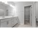 Double vanity bathroom with a large walk-in shower and linen closet at 1040 Westerland Way # 212, Durham, NC 27703