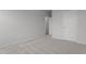 Spacious bedroom with neutral carpeting and a door to hallway at 1040 Westerland Way # 212, Durham, NC 27703