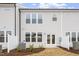 Rear view of townhome with private patio and landscaping at 1040 Westerland Way # 212, Durham, NC 27703
