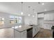 Kitchen features island with granite countertops and stainless steel appliances at 1040 Westerland Way # 212, Durham, NC 27703