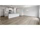 Open kitchen features island, stainless steel appliances, and white cabinetry at 1040 Westerland Way # 212, Durham, NC 27703