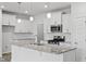 White shaker cabinets, granite countertops and stainless steel appliances at 1040 Westerland Way # 212, Durham, NC 27703
