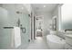 Spa-like bathroom with a soaking tub, glass shower, and marble flooring at 1245 Golfers Vw, Pittsboro, NC 27312
