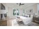 Main bedroom with a king-size bed and large windows overlooking the pool at 1245 Golfers Vw, Pittsboro, NC 27312
