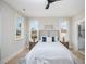 Main bedroom with hardwood floors and multiple windows at 1245 Golfers Vw, Pittsboro, NC 27312