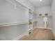 Large walk-in closet with ample shelving and hanging space at 1245 Golfers Vw, Pittsboro, NC 27312