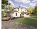 Two-story home with attached garage and herringbone driveway at 1245 Golfers Vw, Pittsboro, NC 27312