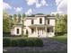 Two-story home with front porch, landscaped yard, and herringbone driveway at 1245 Golfers Vw, Pittsboro, NC 27312