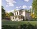 Two-story home with front porch, landscaped yard, and herringbone driveway at 1245 Golfers Vw, Pittsboro, NC 27312