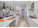 Modern kitchen with large island and stainless steel appliances at 1245 Golfers Vw, Pittsboro, NC 27312