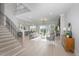 Open living area showcasing hardwood floors and a modern fireplace at 1245 Golfers Vw, Pittsboro, NC 27312