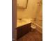 Clean bathroom with single sink vanity, toilet and bathtub at 1714 Fox Hollow Dr, Raleigh, NC 27610