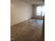 Carpeted bedroom with window and ample space at 1714 Fox Hollow Dr, Raleigh, NC 27610