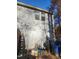 Rear exterior of home with gray siding and yard at 1714 Fox Hollow Dr, Raleigh, NC 27610