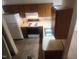 Simple kitchen, wood cabinets, stove and double sink at 1714 Fox Hollow Dr, Raleigh, NC 27610