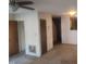 Living room with carpet, ceiling fan and hallway at 1714 Fox Hollow Dr, Raleigh, NC 27610