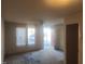 Living room with exterior door and carpet at 1714 Fox Hollow Dr, Raleigh, NC 27610