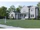 Two-story house with gray and white siding, landscaping, and walkway; mailbox visible at 183 Lookout Rdg, Pittsboro, NC 27312
