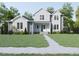 Two-story house with gray and white siding, landscaping, and walkway at 183 Lookout Rdg, Pittsboro, NC 27312