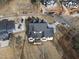 Aerial view of a newly constructed home with a private driveway and landscaping at 2908 Frances Marie Ln, Raleigh, NC 27603