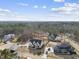 Beautiful aerial shot capturing the home nestled within a serene wooded area, showcasing its modern design at 2908 Frances Marie Ln, Raleigh, NC 27603