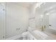 Bathroom showcasing a white vanity with gold fixtures and a large mirror over a tile floor at 2908 Frances Marie Ln, Raleigh, NC 27603