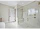 Modern bathroom featuring a walk-in shower with marble tile and gold fixtures at 2908 Frances Marie Ln, Raleigh, NC 27603