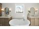 Elegant bathroom with a soaking tub and double vanities, offering a luxurious retreat at 2908 Frances Marie Ln, Raleigh, NC 27603