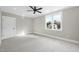 Neutral bedroom featuring a ceiling fan and a bright window to enhance the airy feel at 2908 Frances Marie Ln, Raleigh, NC 27603