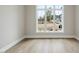 Bedroom has hardwood floors and a large window with a view at 2908 Frances Marie Ln, Raleigh, NC 27603
