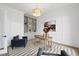 Well-lit home office with stylish furnishings, custom built-ins, and decorative lighting at 2908 Frances Marie Ln, Raleigh, NC 27603
