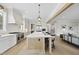 Spacious kitchen features a large island with seating, stainless appliances, and flows into an open-concept living area at 2908 Frances Marie Ln, Raleigh, NC 27603
