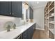 Charming butler's pantry with custom navy cabinetry, sleek countertops, modern fixtures, and stylish decorative accents at 2908 Frances Marie Ln, Raleigh, NC 27603