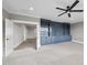Spacious living room with built-in shelving and a modern ceiling fan at 2908 Frances Marie Ln, Raleigh, NC 27603