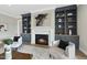 Charming living room with a cozy fireplace, built-in shelving, and comfortable seating for relaxing or entertaining guests at 2908 Frances Marie Ln, Raleigh, NC 27603