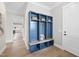 Welcoming mud room featuring a custom blue storage unit and hardwood floors at 2908 Frances Marie Ln, Raleigh, NC 27603