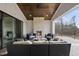 Inviting outdoor patio with a stone fireplace and comfortable seating area at 2908 Frances Marie Ln, Raleigh, NC 27603