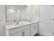 Bright bathroom featuring a double vanity with white cabinets and a large mirror at 420 Blue Aspen Dr, Fuquay Varina, NC 27526