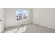 Sunny bedroom features a window and carpeted floors at 420 Blue Aspen Dr, Fuquay Varina, NC 27526