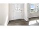 Bright entryway with decorative glass front door and wood-look flooring at 420 Blue Aspen Dr, Fuquay Varina, NC 27526