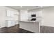 Kitchen featuring an island with granite countertops and white cabinets at 420 Blue Aspen Dr, Fuquay Varina, NC 27526