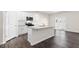 Kitchen featuring an island with granite countertops and white cabinets at 420 Blue Aspen Dr, Fuquay Varina, NC 27526